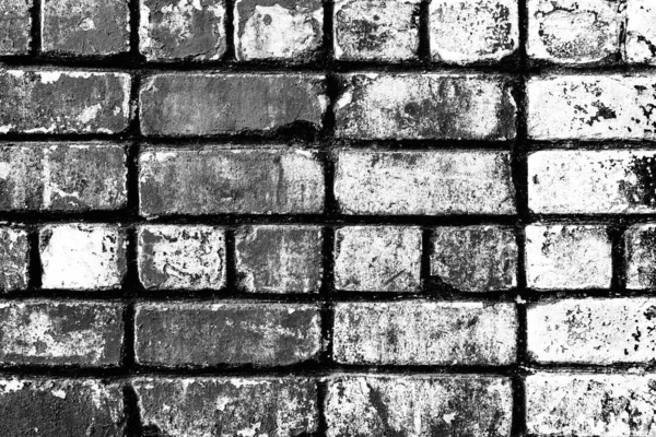 Texture of a brick wall with cracks and scratches which can be used as a background — Stock Photo, Image