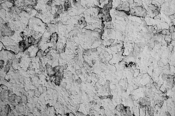 Texture d'un mur en béton avec des fissures et des rayures qui peuvent être utilisées comme fond — Photo