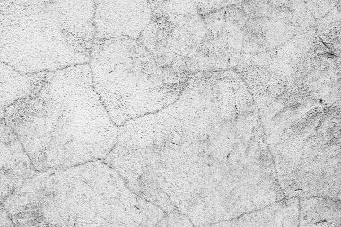 Çatlakları ve çizikleri olan beton bir duvarın dokusu arka plan olarak kullanılabilir.