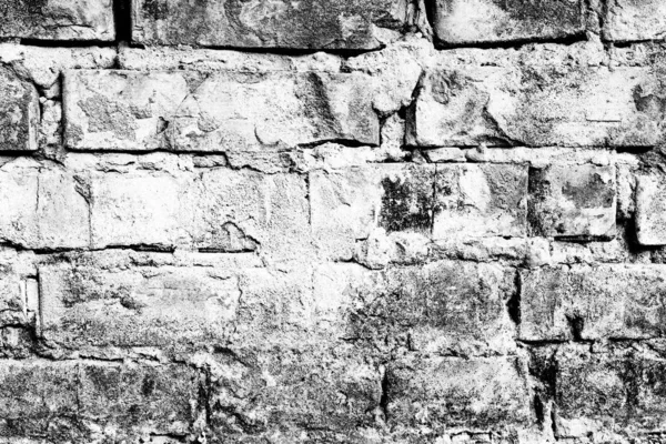 Текстура кирпичной стены с трещинами и царапинами, которые могут быть использованы в качестве фона — стоковое фото