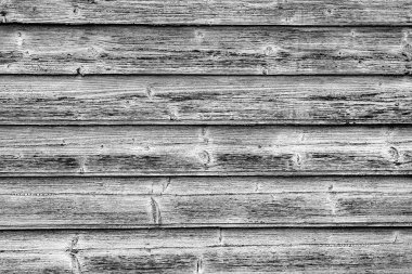 Arkaplan olarak kullanılabilecek çatlakları ve çizikleri olan ahşap bir duvarın dokusu