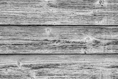 Arkaplan olarak kullanılabilecek çatlakları ve çizikleri olan ahşap bir duvarın dokusu