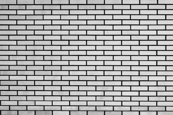 Textura de uma parede de tijolo com fendas e arranhões que podem usar-se como um contexto — Fotografia de Stock