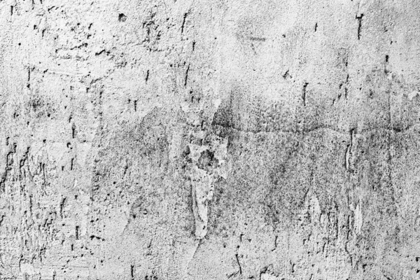 Texture d'un mur en béton avec des fissures et des rayures qui peuvent être utilisées comme fond — Photo