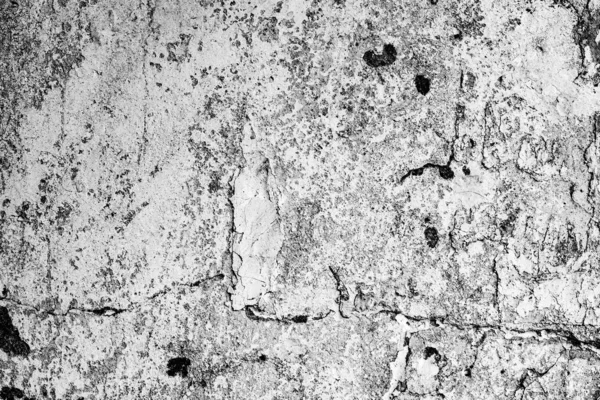 Texture d'un mur en béton avec des fissures et des rayures qui peuvent être utilisées comme fond — Photo