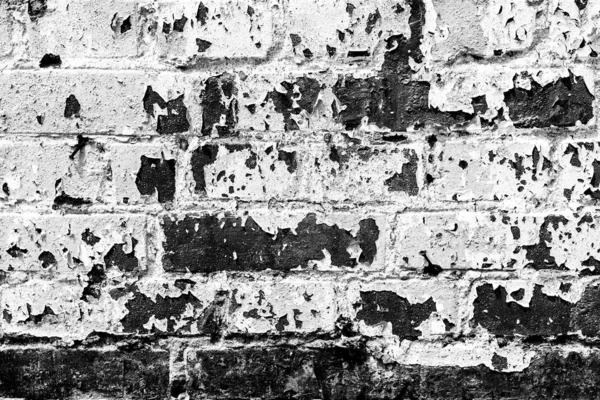 Textura de una pared de ladrillo con grietas y arañazos que se puede utilizar como fondo —  Fotos de Stock