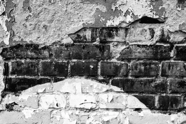 Texture of a brick wall with cracks and scratches which can be used as a background — Stock Photo, Image