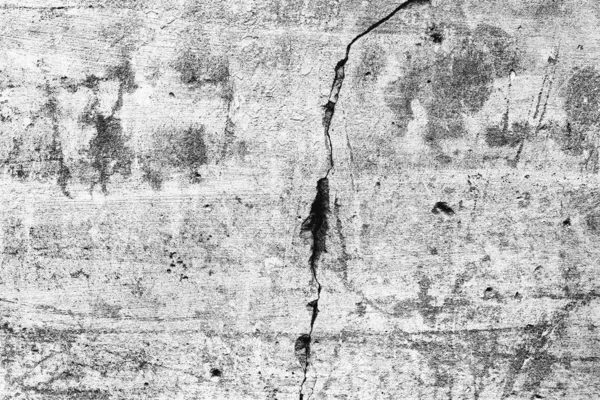 Texture d'un mur en béton avec des fissures et des rayures qui peuvent être utilisées comme fond — Photo