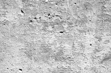 Çatlakları ve çizikleri olan beton bir duvarın dokusu arka plan olarak kullanılabilir.