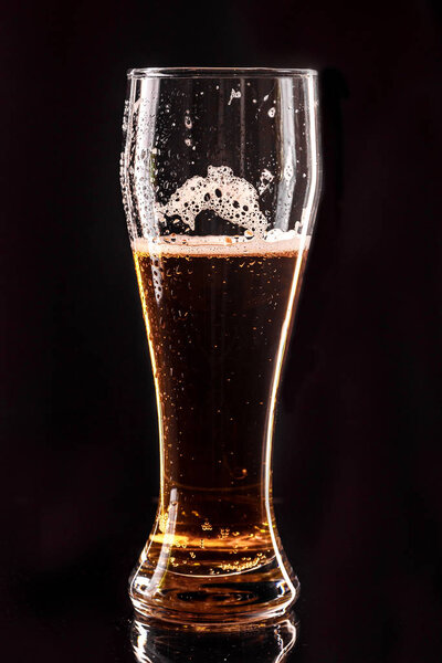 Glass beer on wood background with copy space