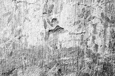 Çatlakları ve çizikleri olan beton bir duvarın dokusu arka plan olarak kullanılabilir.