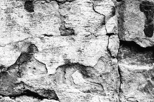 Texture d'un mur en béton avec des fissures et des rayures qui peuvent être utilisées comme fond — Photo