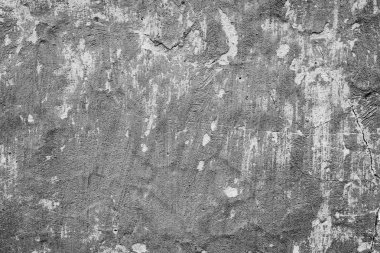 Çatlakları ve çizikleri olan beton bir duvarın dokusu arka plan olarak kullanılabilir.