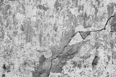 Çatlakları ve çizikleri olan beton bir duvarın dokusu arka plan olarak kullanılabilir.