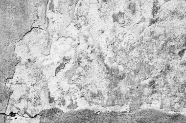 Çatlakları ve çizikleri olan beton bir duvarın dokusu arka plan olarak kullanılabilir.