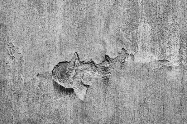 Textuur van een betonnen wand met scheuren en krassen die als achtergrond kunnen worden gebruikt — Stockfoto