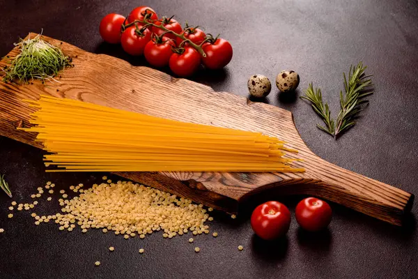 Ingredients for cooking paste on a dark background — Stock Photo, Image