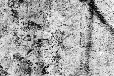 Çatlakları ve çizikleri olan beton bir duvarın dokusu arka plan olarak kullanılabilir.