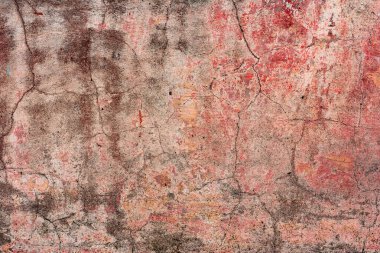 Çatlakları ve çizikleri olan beton bir duvarın dokusu arka plan olarak kullanılabilir.