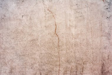 Doku, duvar, beton, arka plan olarak kullanılabilir. Çizik ve çatlaklarla dolu bir duvar parçası.