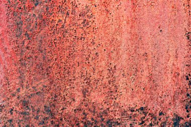 Çatlakları ve çizikleri olan metal bir duvarın dokusu arka plan olarak kullanılabilir.