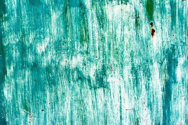 Çatlakları ve çizikleri olan metal bir duvarın dokusu arka plan olarak kullanılabilir.