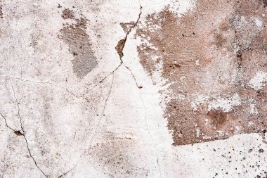 Doku, duvar, beton, arka plan olarak kullanılabilir. Çizik ve çatlaklarla dolu bir duvar parçası.