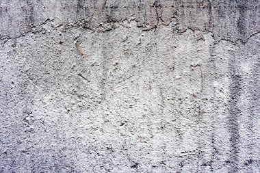 Doku, duvar, beton, arka plan olarak kullanılabilir. Çizik ve çatlaklarla dolu bir duvar parçası.