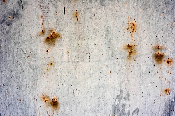 Texture of a metal wall with cracks and scratches which can be used as a background