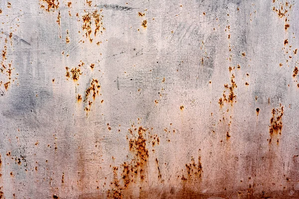 Texture of a metal wall with cracks and scratches which can be used as a background