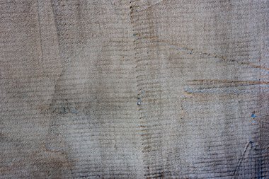 Doku, duvar, beton, arka plan olarak kullanılabilir. Çizik ve çatlaklarla dolu bir duvar parçası.