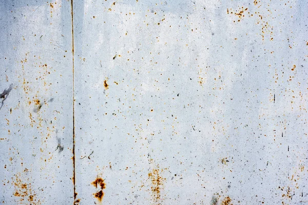 Texture of a metal wall with cracks and scratches which can be used as a background