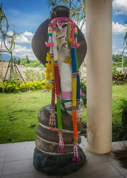 Krabi Town. Statuette of the sacred cobra. — Stock Photo, Image