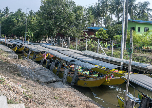 Parking tourist boats on one of the channels of the Chao Phraya 