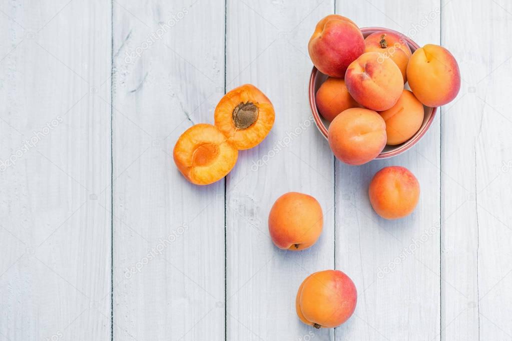 Composition with apricots on a white table