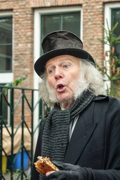 Scrooge one of the characters from the famous books of Dickens during the Dickens Festival in Deventer in The Netherlands — Stock Photo, Image