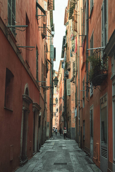 Nice, France, September 6, 2018: Impression of a narrow street in the old center of Nice in France