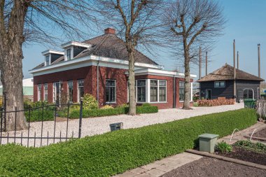 Nootdorp, The Netherlands, April 7, 2019:  Beautiful bungalow  with kitchen garden and a hay loft converted into a home situated between huge greenhouses
