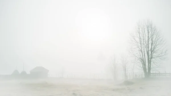 Misty countryside landscape in a mountain village Stock Picture