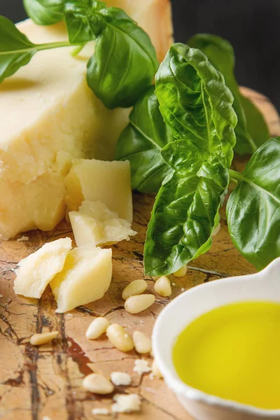 Italian parmesan cheese with knife fresh green basil, olive oil, — Stock Photo, Image