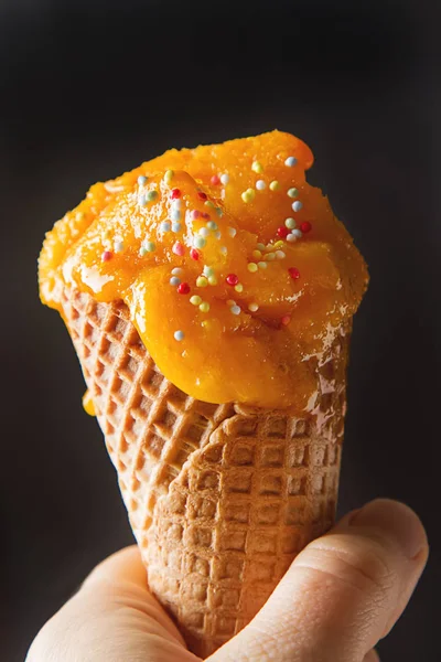 Frozen yellow mango sorbet, berry ice cream cone with mint and b — Stock Photo, Image