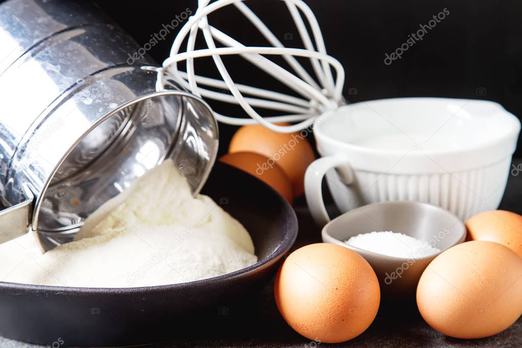 Ingredients for pancakes, flour, milk, eggs. Traditional for the