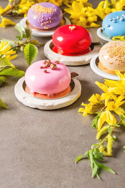 Fashionable mousse cake with a mirror glaze decorated with sprin — Stock Photo, Image