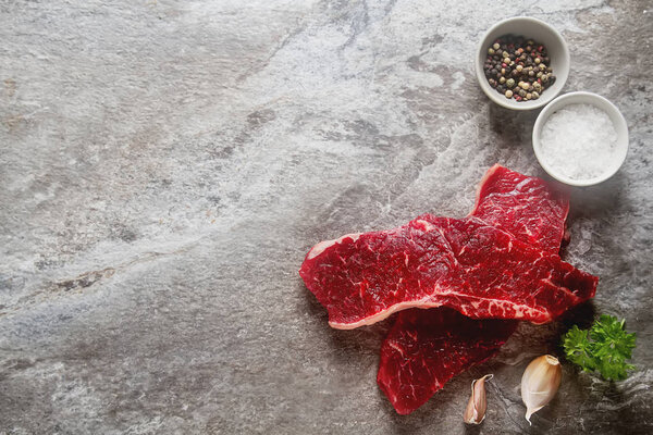 A quality piece of meat, beef. Dark background.