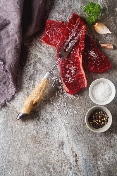 A quality piece of meat, beef. Dark background.