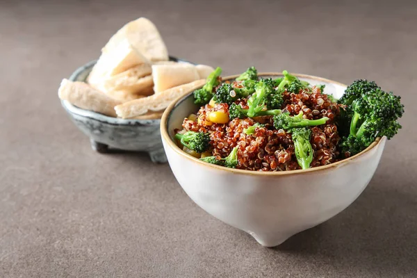 Quinoa salad with broccoli and corn with pitta bread. The concep