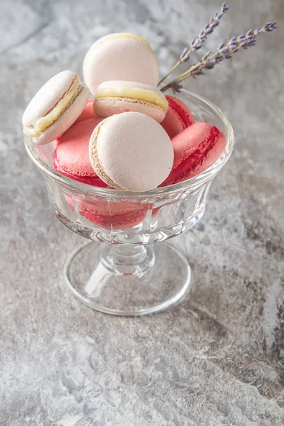 Traditional French sweets. Assorted pink, white macaroon with dr