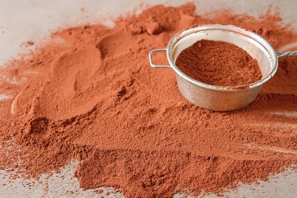 Natural cocoa powder in a clay bowl for chocolate and baking. Co