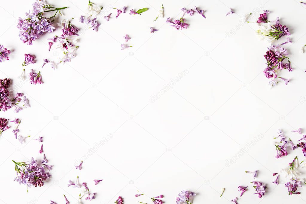 Spring flowers. Lilac flowers on white wooden background. Top vi