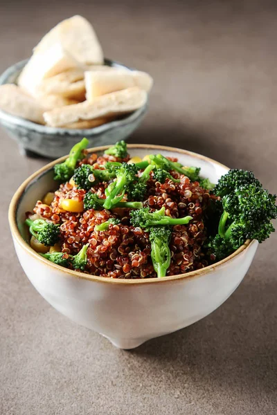 Quinoa salad with broccoli and corn with pitta bread. The concep